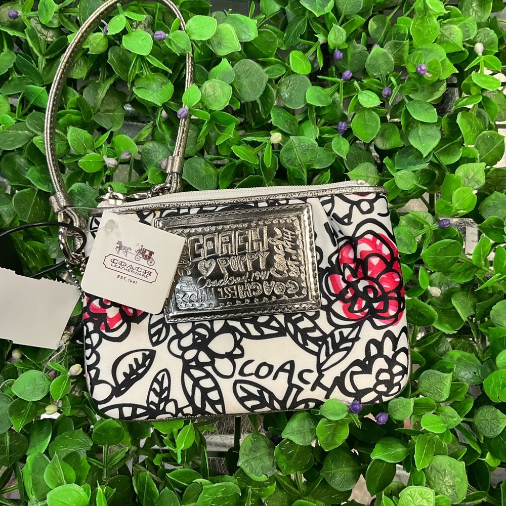 COACH White Floral Wristlet with Silver Plaque